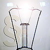 Filament lamp in front of paragraph symbol